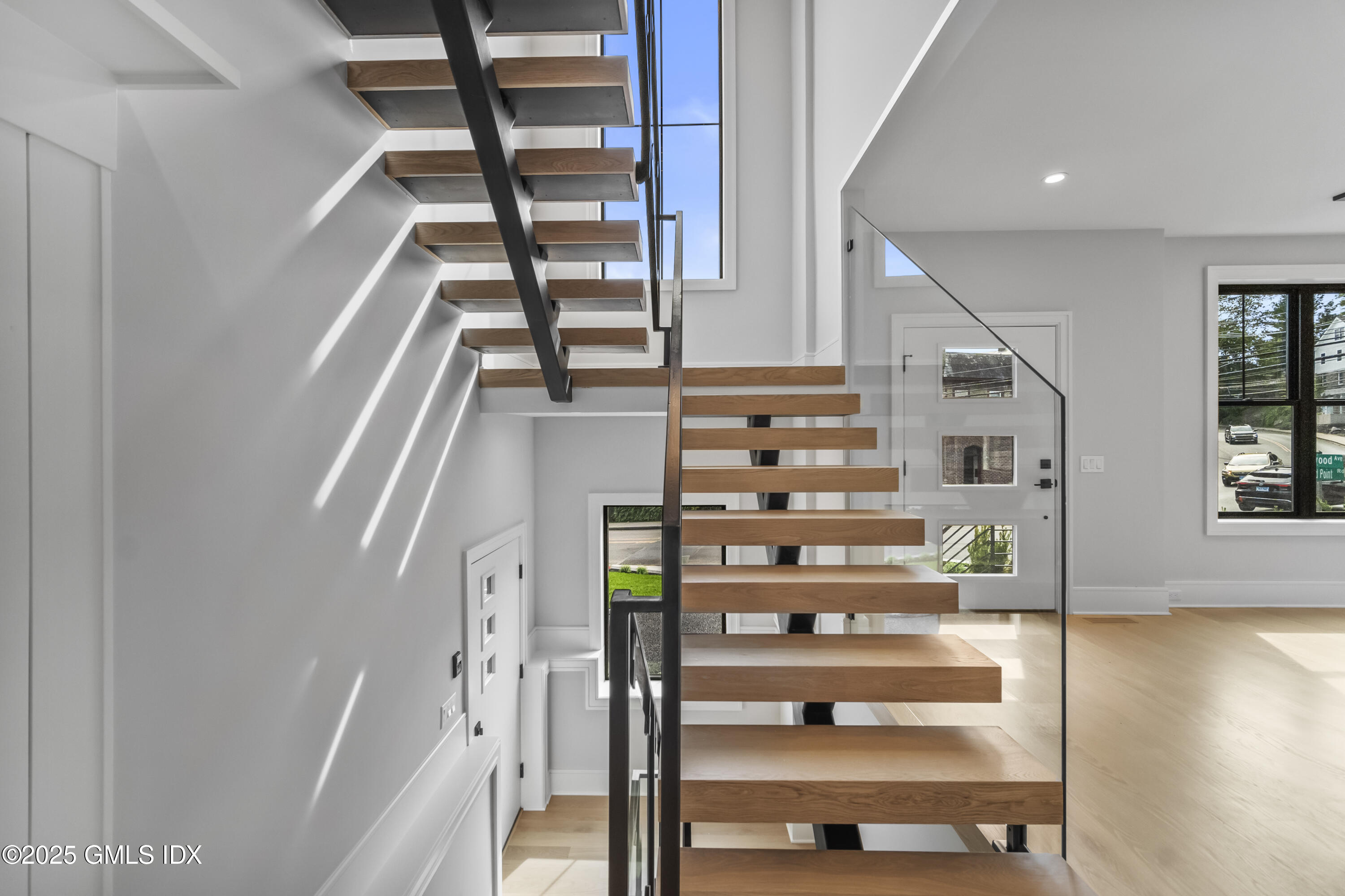 71 Old Field Point Road Greenwich, CT 06830 - Photo 10 of 33 a view of entryway and hall with wooden floor