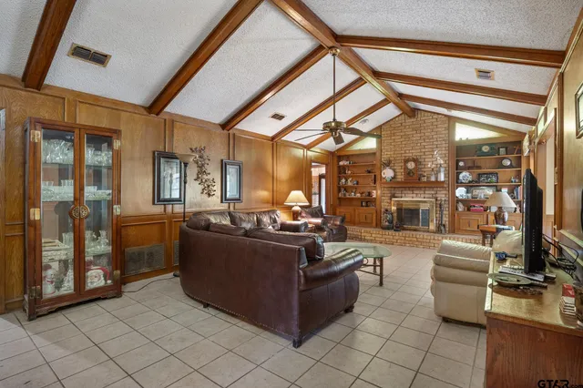 a living room with furniture and a table