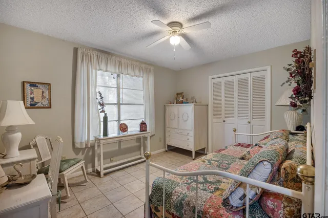 a bedroom with furniture and a window
