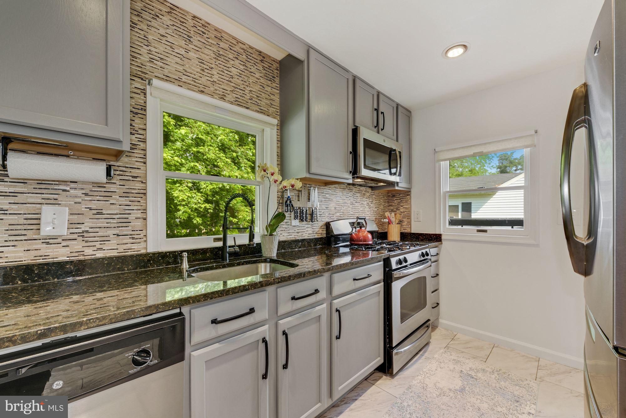 12302 Dewey Road Silver Spring, MD 20906 - Photo 5 of 26 Chic Kitchen with Stainless Steel Appliances