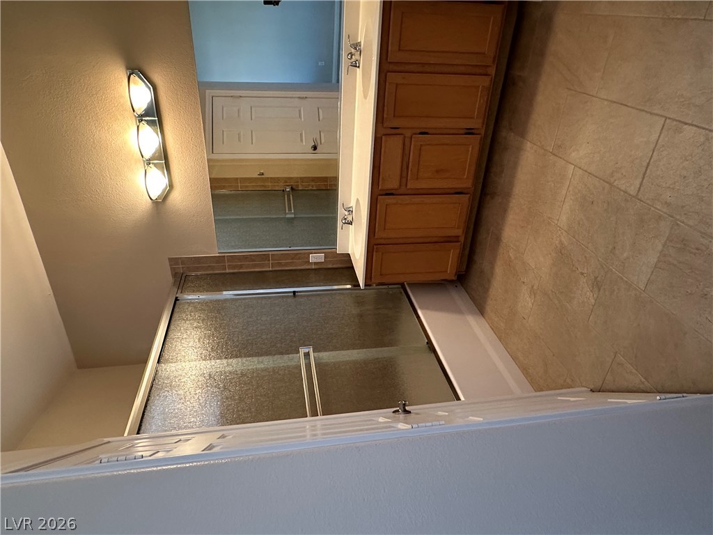 1922 Thunder Ridge Circle Henderson, NV 89012 - Photo 22 of 27 Functional bathroom features a dual vanity and a well-maintained shower with glass enclosure.