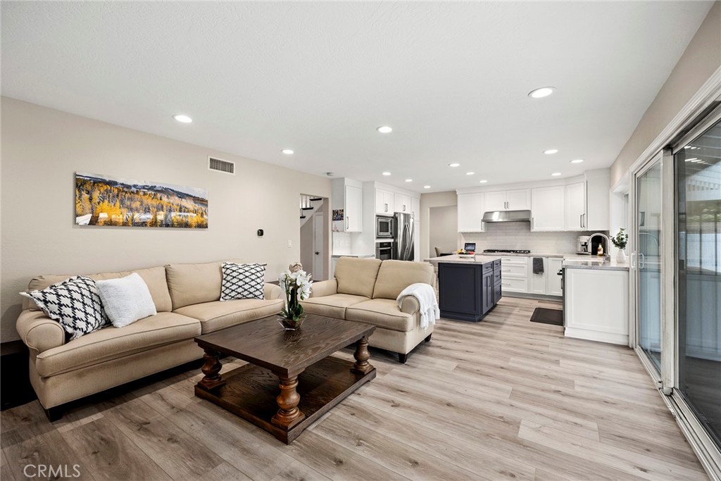 2352 Caper Tree Drive Tustin, CA 92780 - Photo 11 of 29 a living room with furniture kitchen view and a table