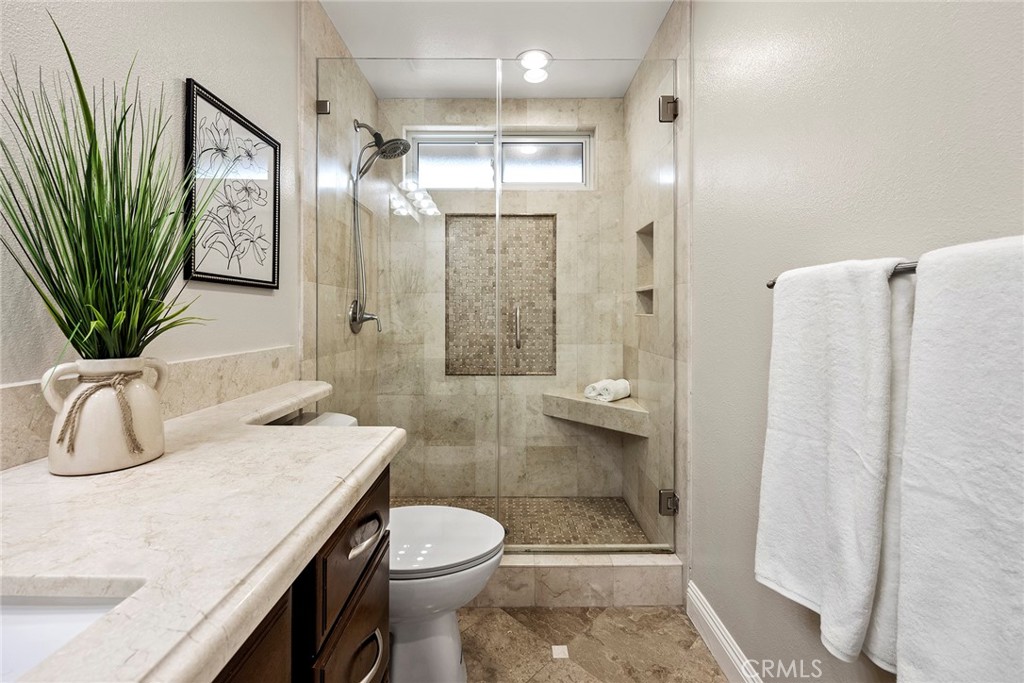 2352 Caper Tree Drive Tustin, CA 92780 - Photo 18 of 29 a bathroom with a sink a toilet and shower