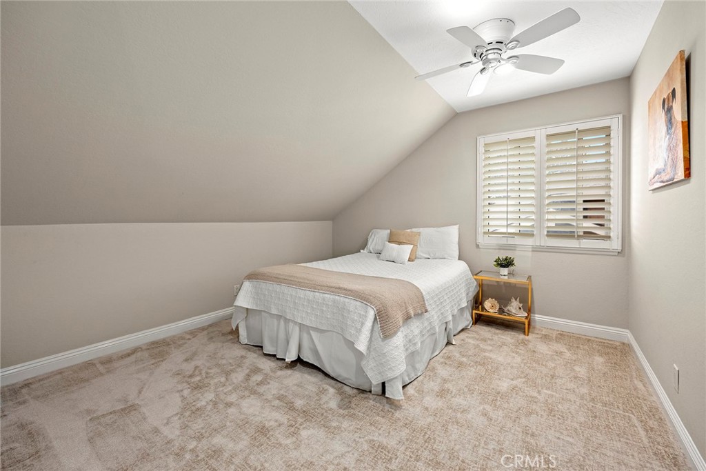2352 Caper Tree Drive Tustin, CA 92780 - Photo 21 of 29 a spacious bedroom with a bed and a window