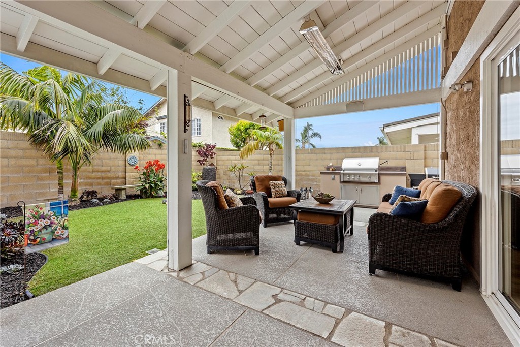 2352 Caper Tree Drive Tustin, CA 92780 - Photo 23 of 29 a living room with patio furniture and garden
