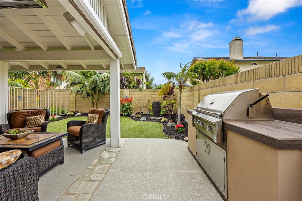 2352 Caper Tree Drive Tustin, CA 92780 - Photo 24 of 29 a view of a patio with couches chairs and a table