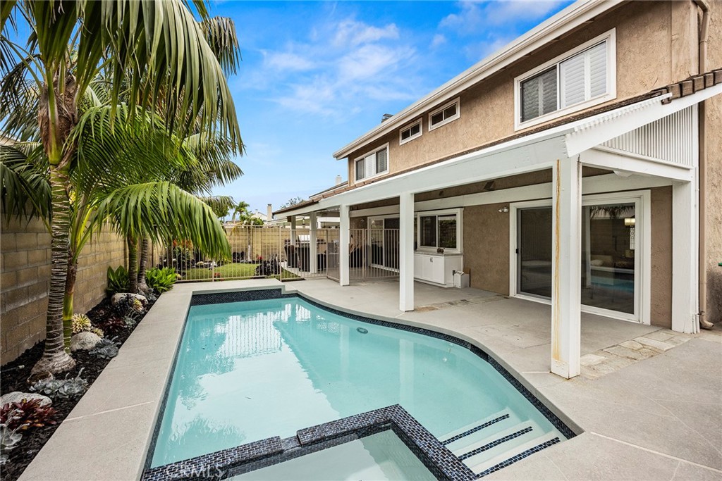 2352 Caper Tree Drive Tustin, CA 92780 - Photo 26 of 29 front view of a house with a swimming pool