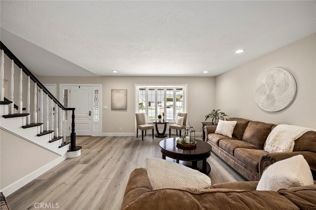 2352 Caper Tree Drive Tustin, CA 92780 - Photo 3 of 29 a living room with furniture and a large window