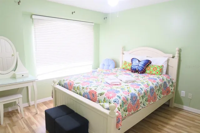 a bedroom with a bed and a dresser