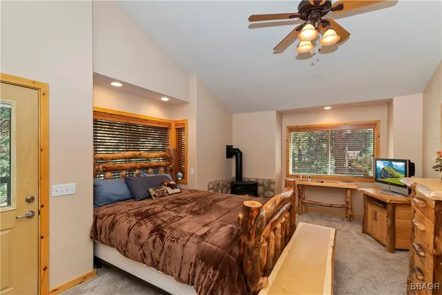 a bed room with a bed and a large window