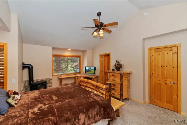 a bed room with a bed and a chandelier