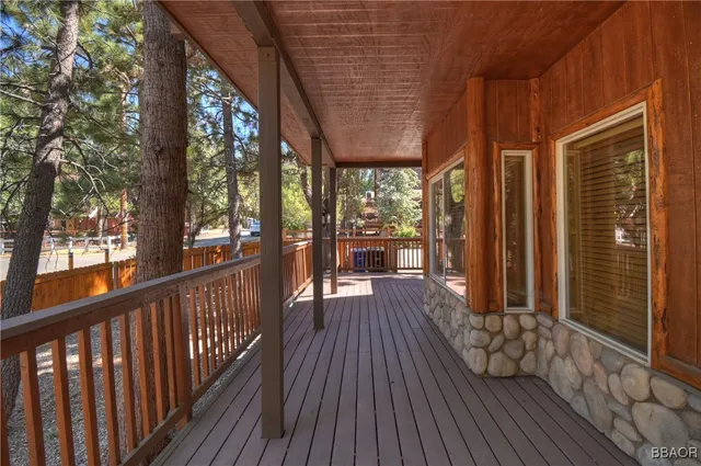 a view of outdoor space with wooden floor and outdoor seating