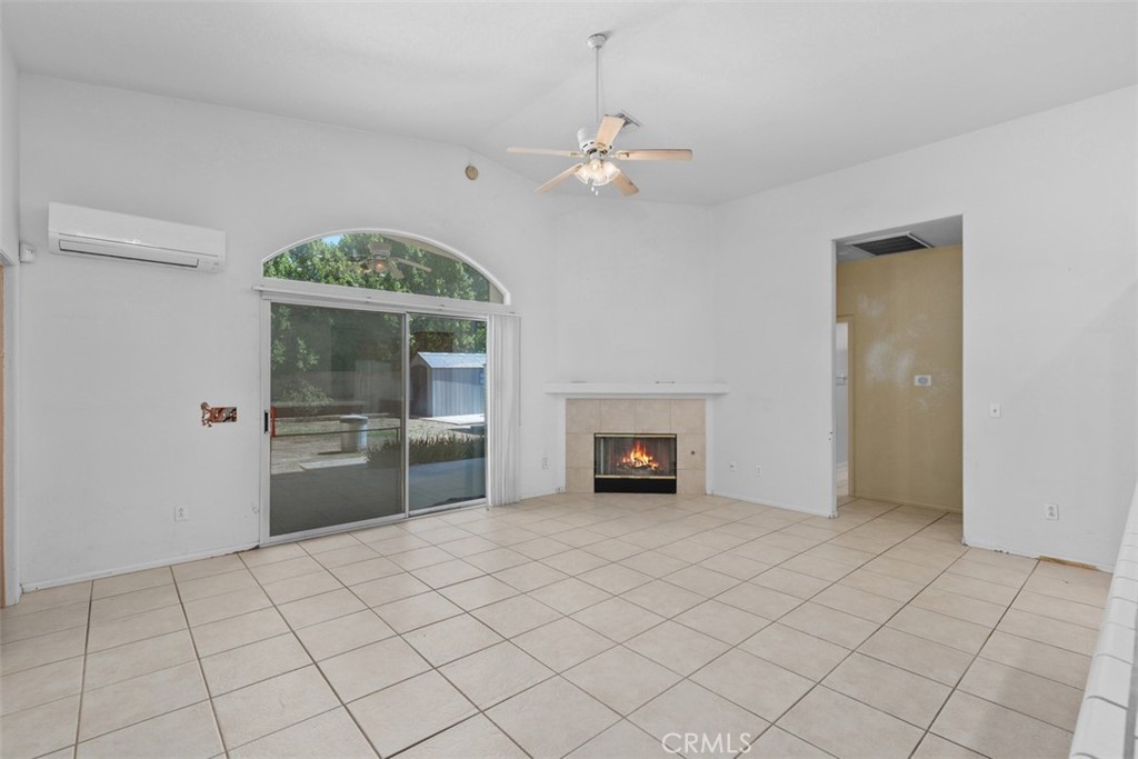 68744 Durango Road Cathedral City, CA 92234 - Photo 12 of 36 a view of an empty room with a fireplace