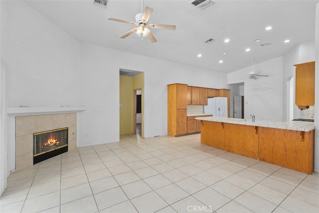 68744 Durango Road Cathedral City, CA 92234 - Photo 14 of 36 a view of a kitchen with furniture and a kitchen