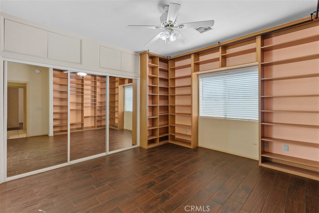 68744 Durango Road Cathedral City, CA 92234 - Photo 24 of 36 wooden floor in an empty room with a window