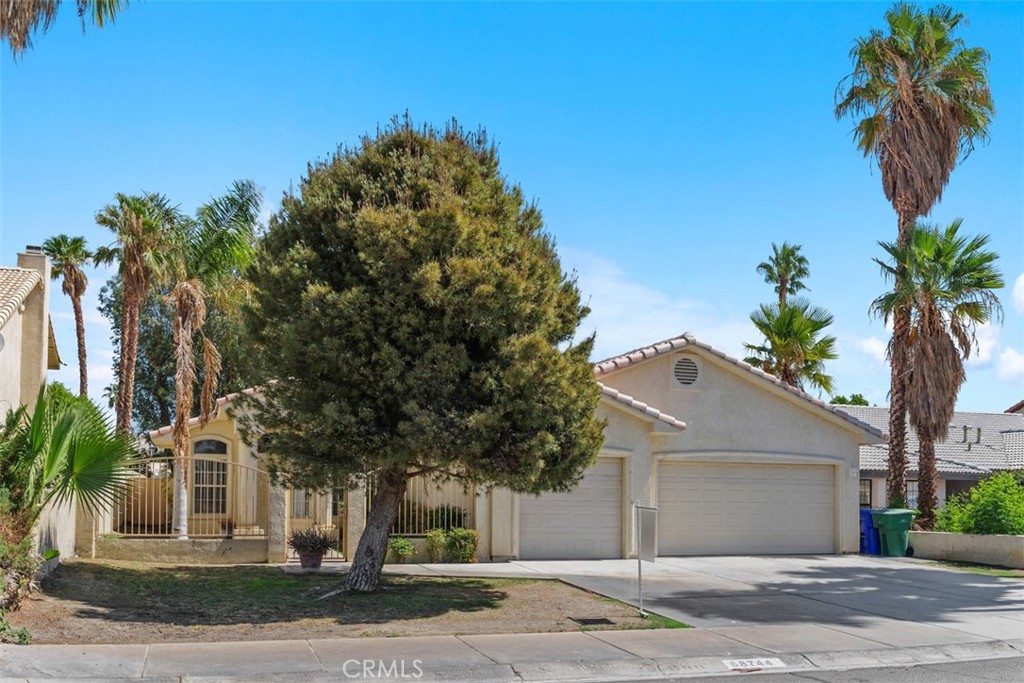 68744 Durango Road Cathedral City, CA 92234 - Photo 3 of 36 a front view of a house with garden