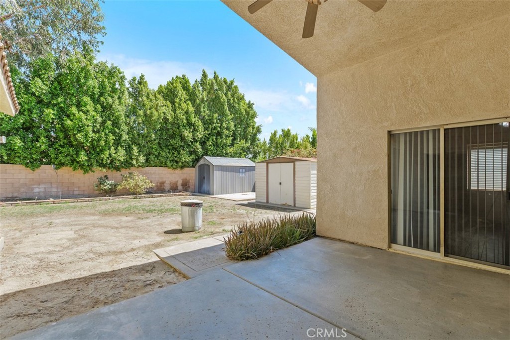 68744 Durango Road Cathedral City, CA 92234 - Photo 32 of 36 a house with trees in front of it