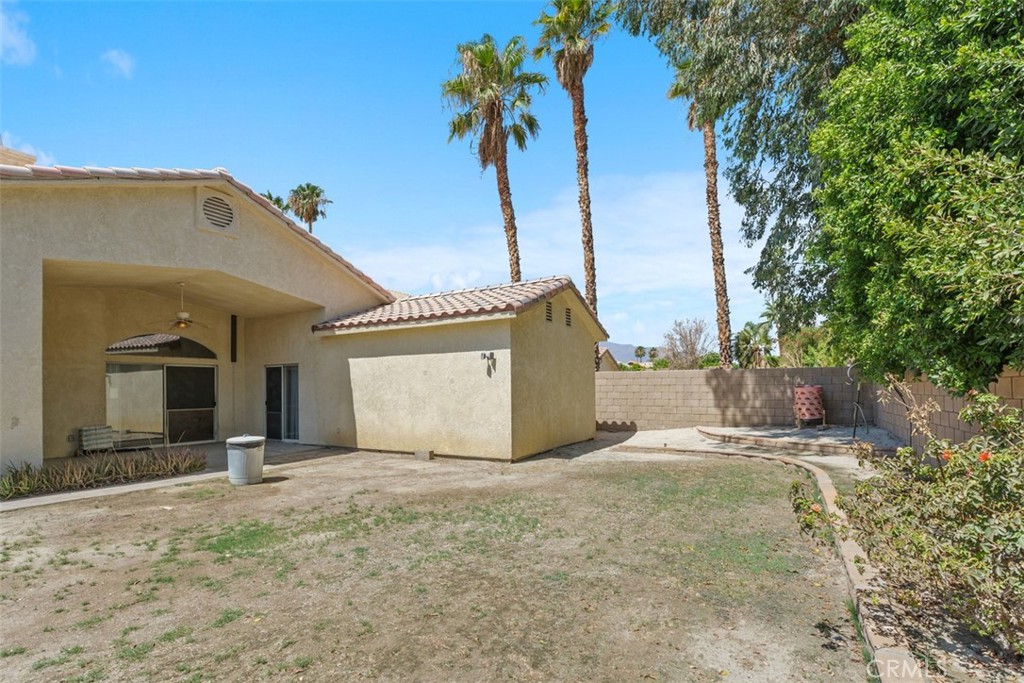 68744 Durango Road Cathedral City, CA 92234 - Photo 35 of 36 a view of a house with a yard