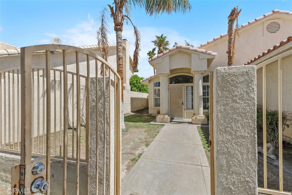 68744 Durango Road Cathedral City, CA 92234 - Photo 4 of 36 a view of a front door and outdoor space
