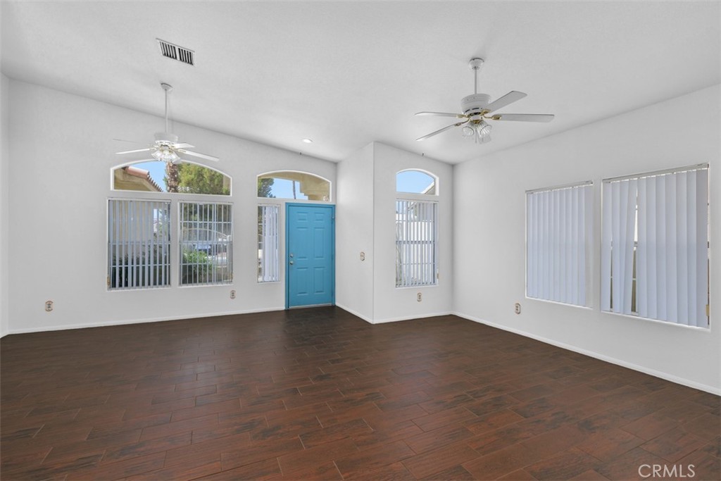 68744 Durango Road Cathedral City, CA 92234 - Photo 8 of 36 a view of an empty room with a window and wooden floor