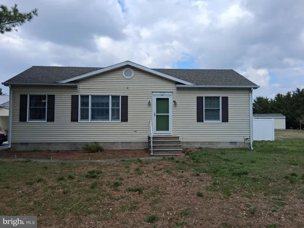 a front view of a house with yard