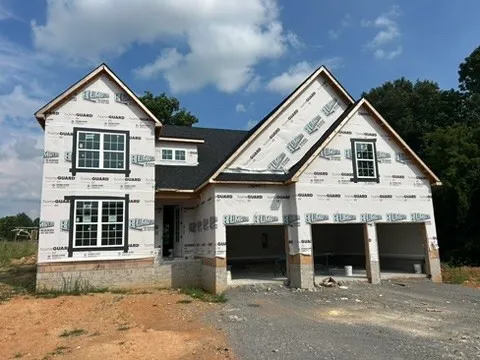 a view of a house with large windows