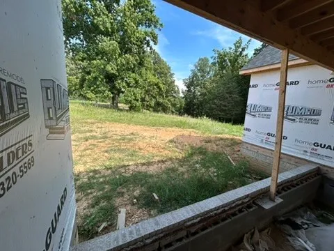 a view of a yard from a balcony