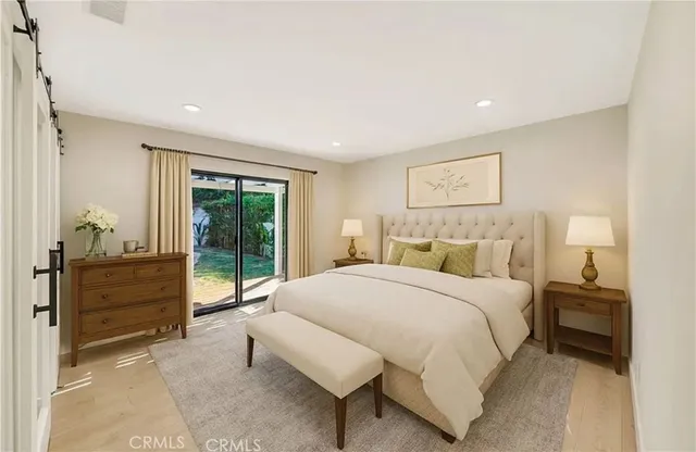 a kitchen with stainless steel appliances granite countertop a refrigerator a sink and a stove