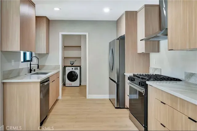 a living room with furniture kitchen view and a table