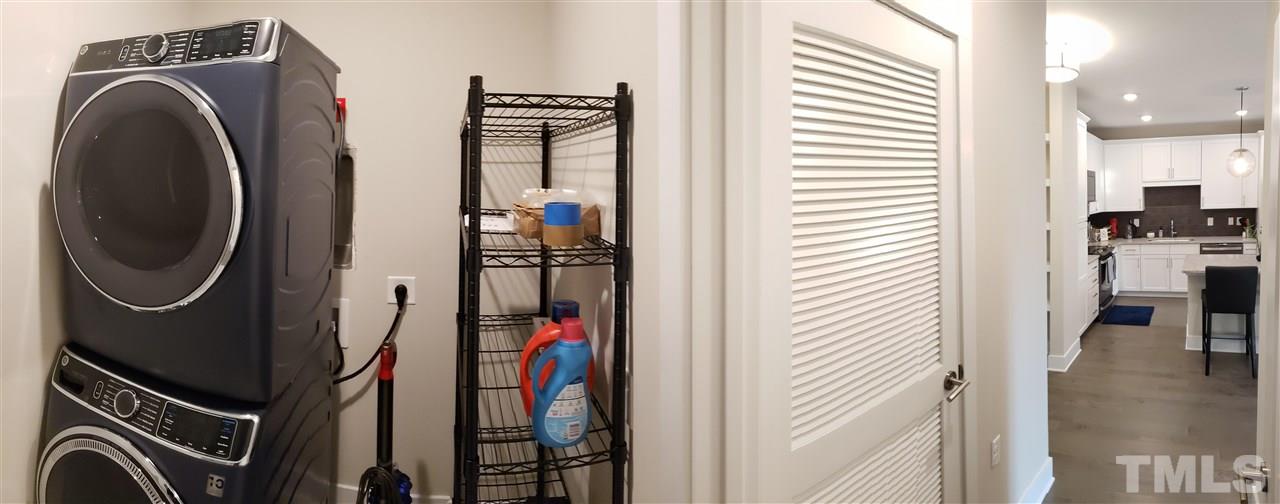 105 Chatham Walk Lane, Unit 404 Cary, NC 27511 - Photo 11 of 12 a view of a storage and utility room with washer and dryer