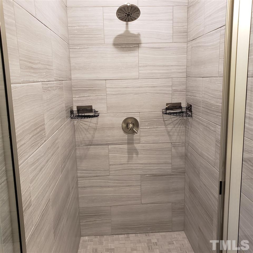 105 Chatham Walk Lane, Unit 404 Cary, NC 27511 - Photo 7 of 12 a bathroom with a shower