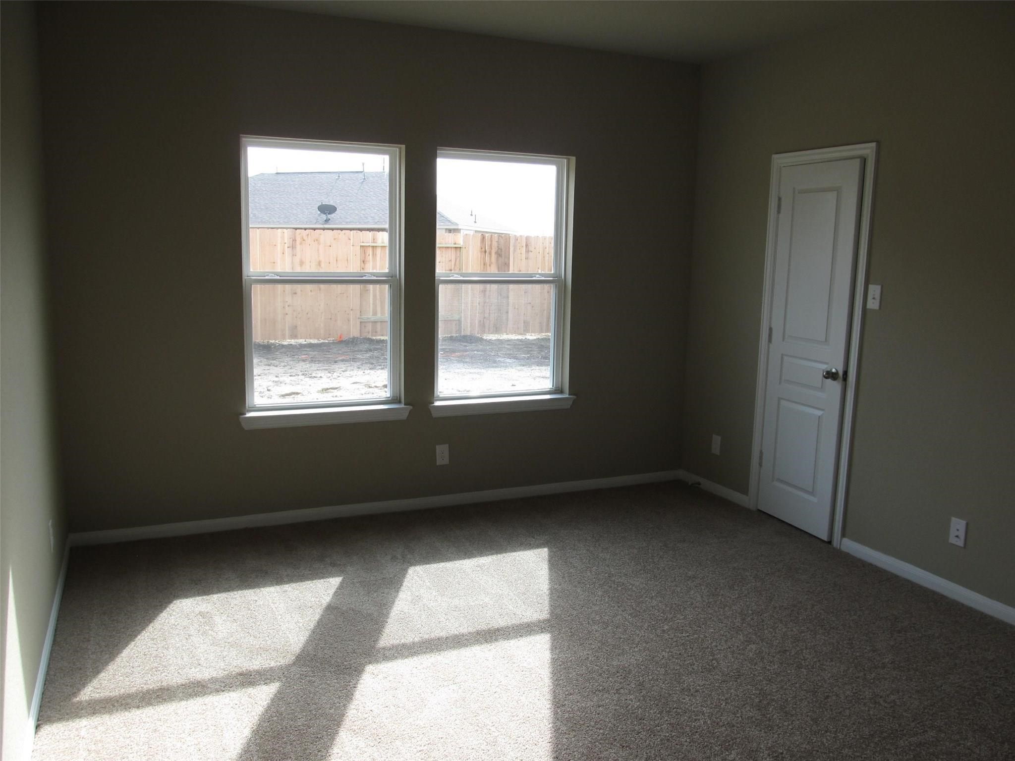 2310 Thunderbolt Peak Drive Rosharon, TX 77583 - Photo 12 of 27 an empty room with a window