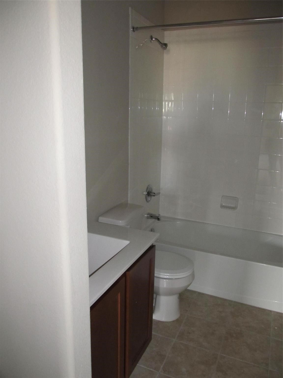 2310 Thunderbolt Peak Drive Rosharon, TX 77583 - Photo 13 of 27 a bathroom with a sink a toilet and shower