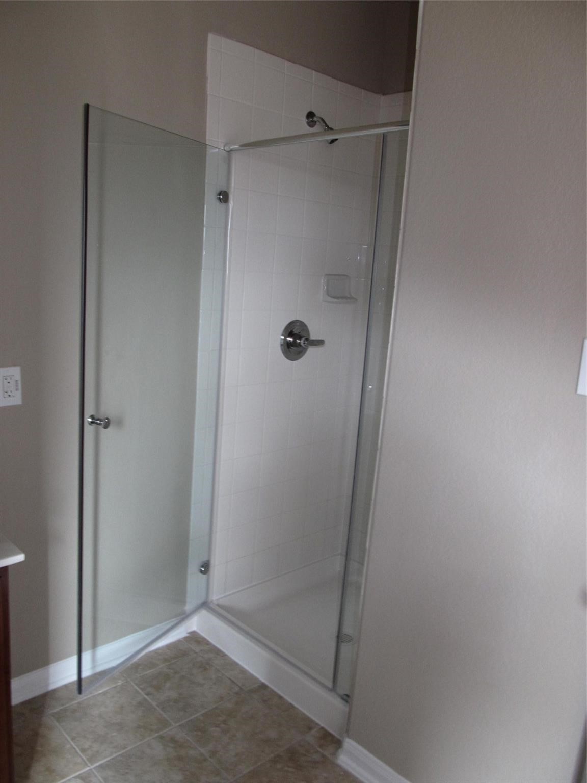 2310 Thunderbolt Peak Drive Rosharon, TX 77583 - Photo 16 of 27 a bathroom with a glass door shower