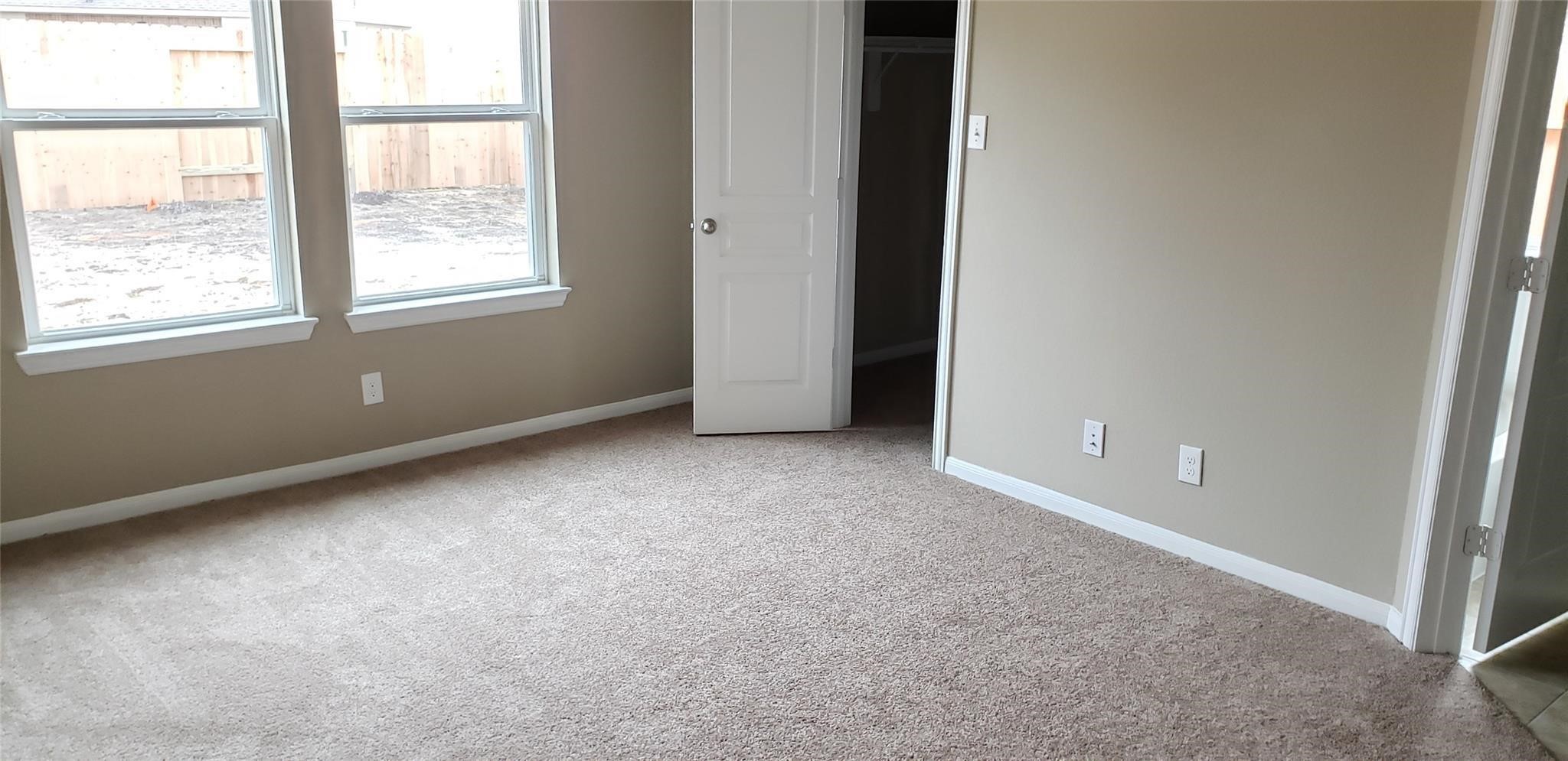 2310 Thunderbolt Peak Drive Rosharon, TX 77583 - Photo 19 of 27 an empty room with windows