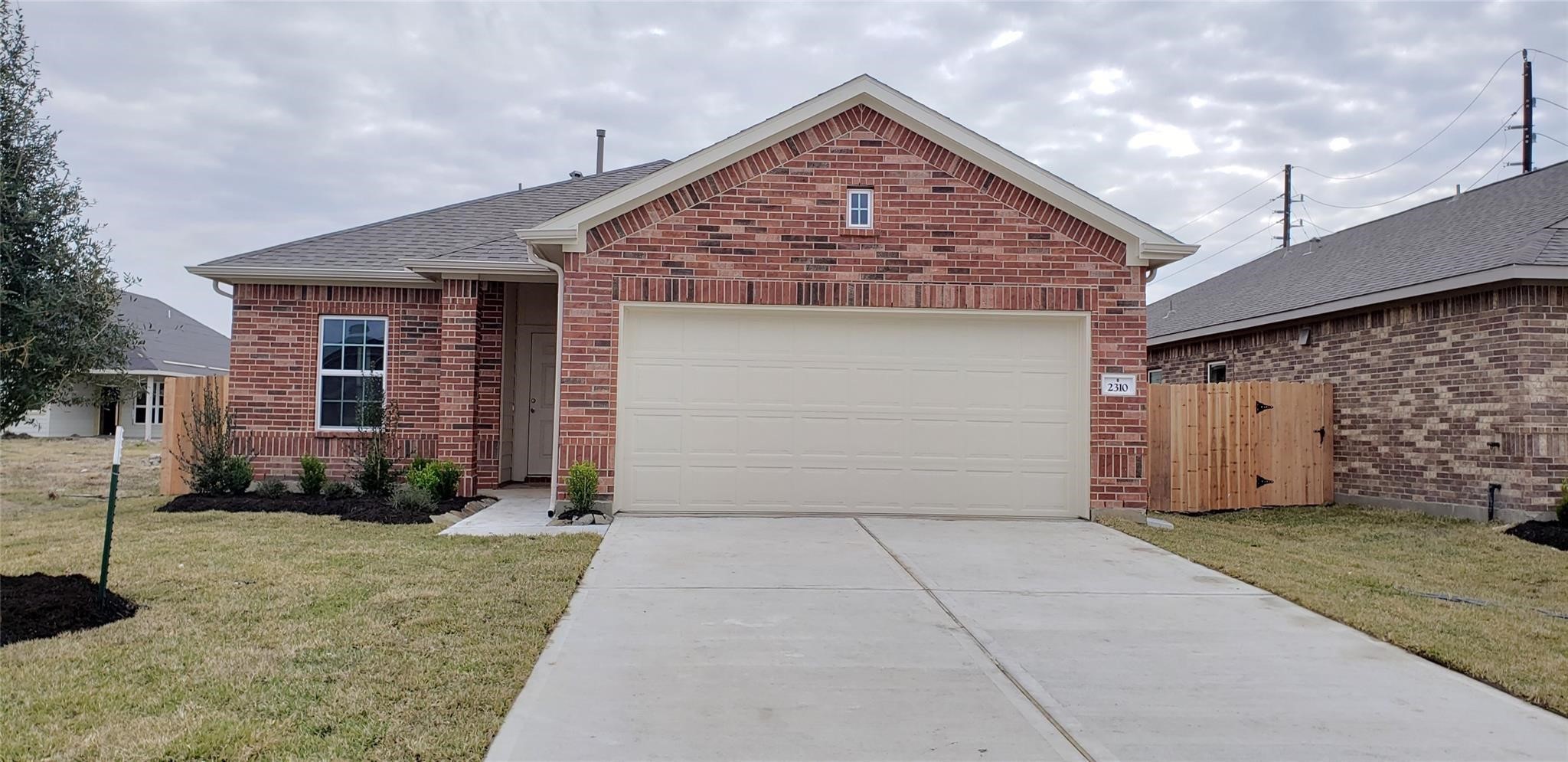 2310 Thunderbolt Peak Drive Rosharon, TX 77583 - Photo 2 of 27 a front view of a house with a yard