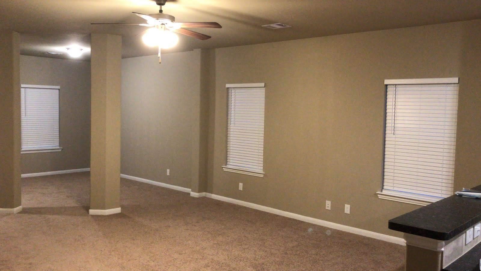 2310 Thunderbolt Peak Drive Rosharon, TX 77583 - Photo 21 of 27 an empty room with windows and fan