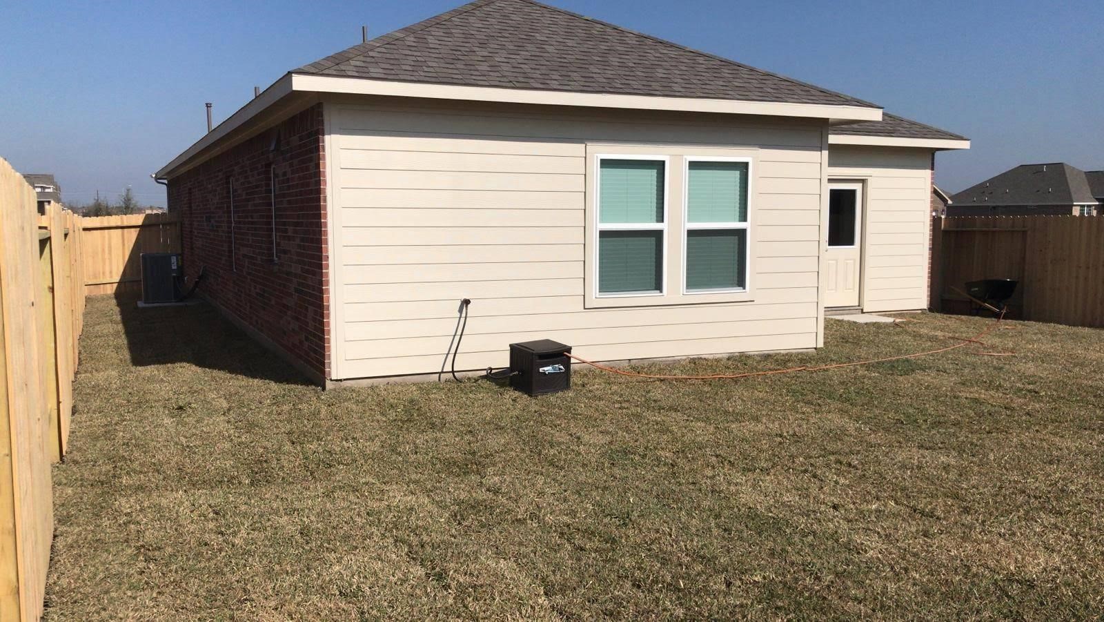 2310 Thunderbolt Peak Drive Rosharon, TX 77583 - Photo 26 of 27 a view of a house with backyard