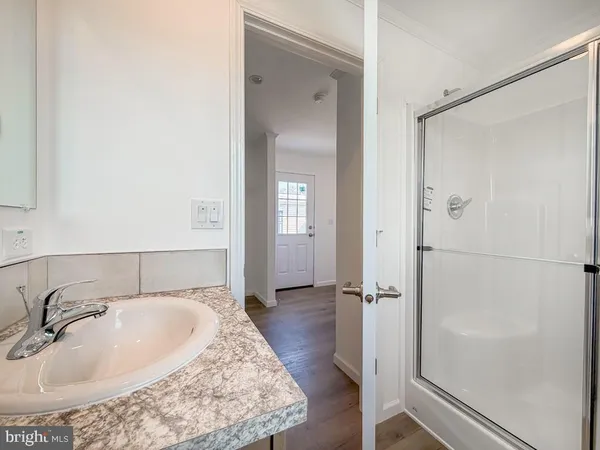 a bathroom with a sink and shower