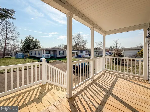 a view of a balcony with wooden floor