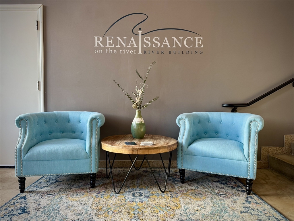 35 Riverwalk Way, Unit R302 Lowell, MA 01854 - Photo 12 of 20 a living room with furniture and a table