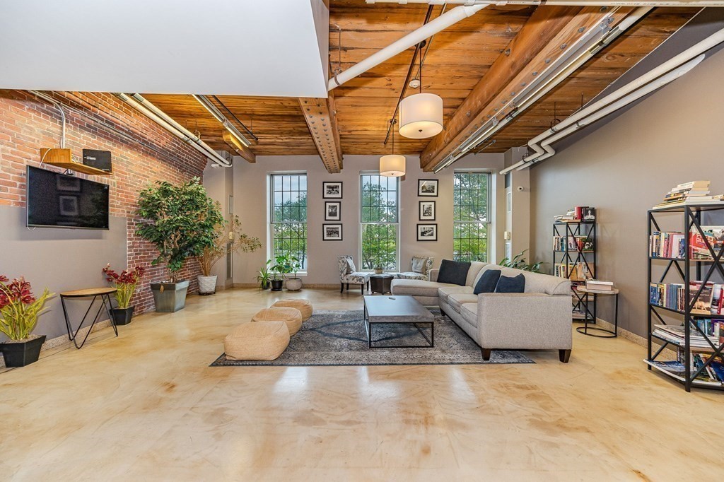 35 Riverwalk Way, Unit R302 Lowell, MA 01854 - Photo 16 of 20 a living room with furniture