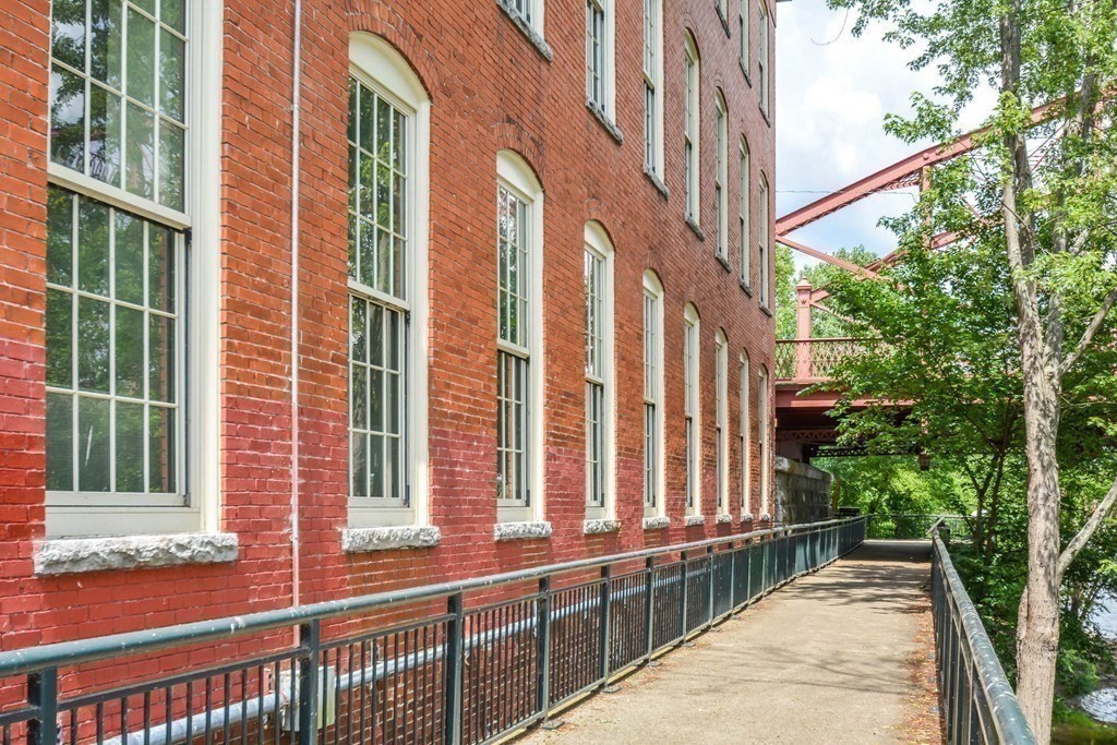 35 Riverwalk Way, Unit R302 Lowell, MA 01854 - Photo 20 of 20 a view of a building from a balcony