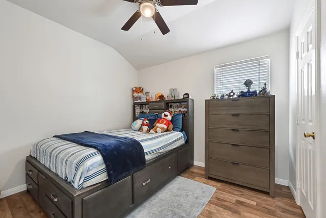 a bedroom with a bed and a dresser