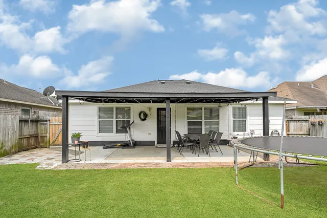 a view of a house with swimming pool and porch