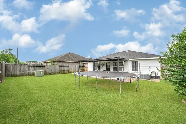 a view of a house with a yard porch and sitting area