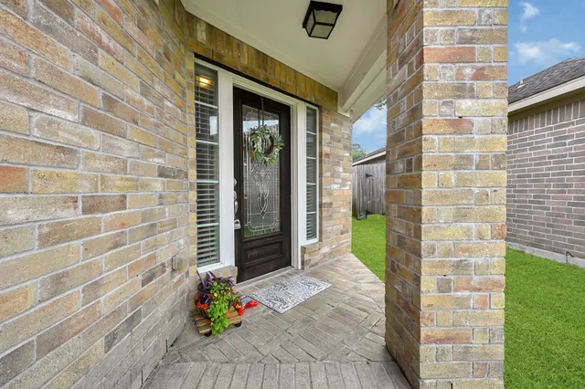 a view of a brick wall with a window
