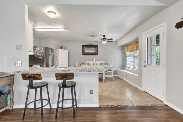 a kitchen with a table and chairs in it
