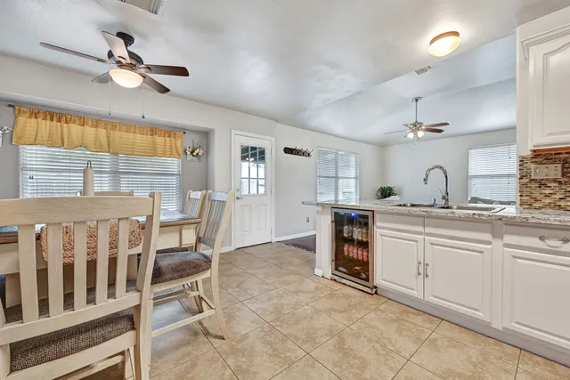 a kitchen with a sink cabinets and window