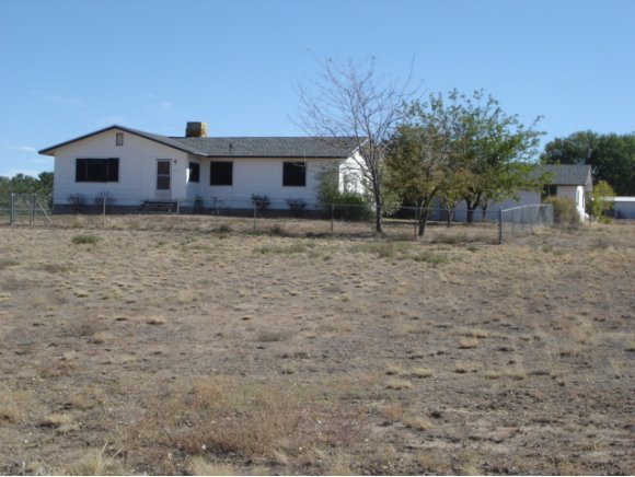 2117 North Reed Road Chino Valley, AZ 86323 - Photo 1 of 11 a front view of a house with a garden